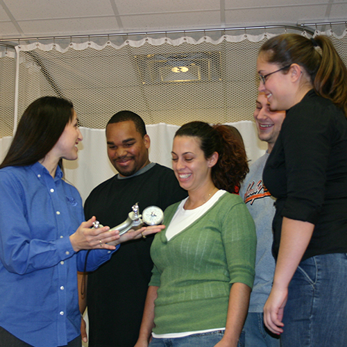 Instructor teaching four students
