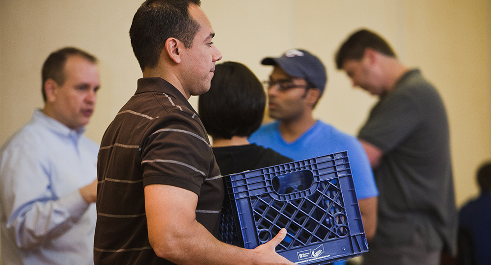 Man lifting crate during course