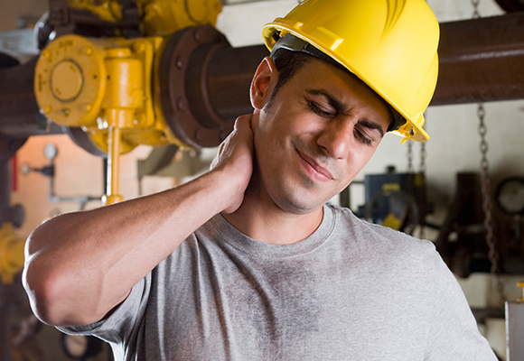 Man grabbing injured neck