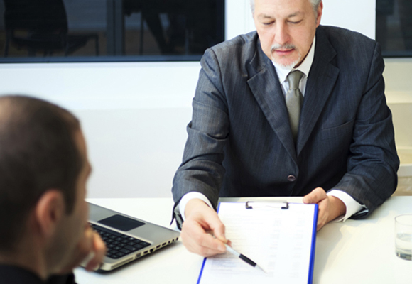 Attorney discussing forms with his client