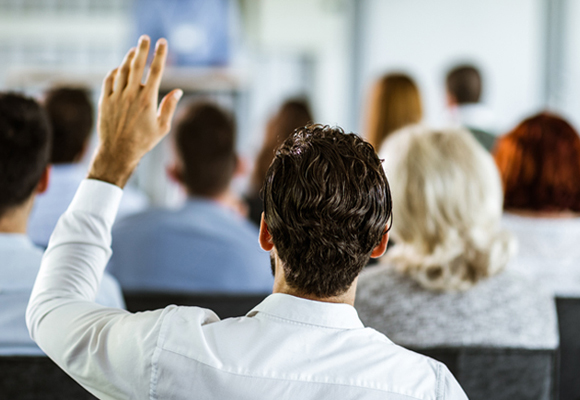 attendee-raising-hand