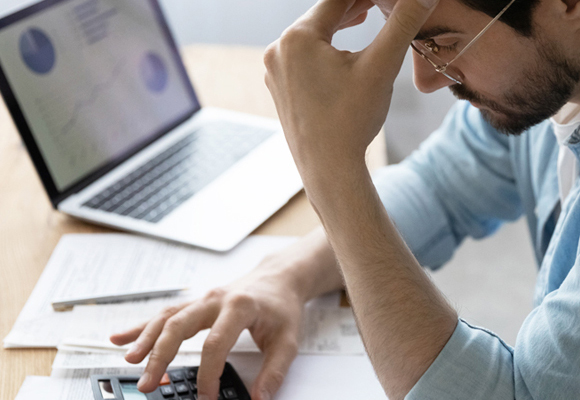 Man grabbing his head in frustration