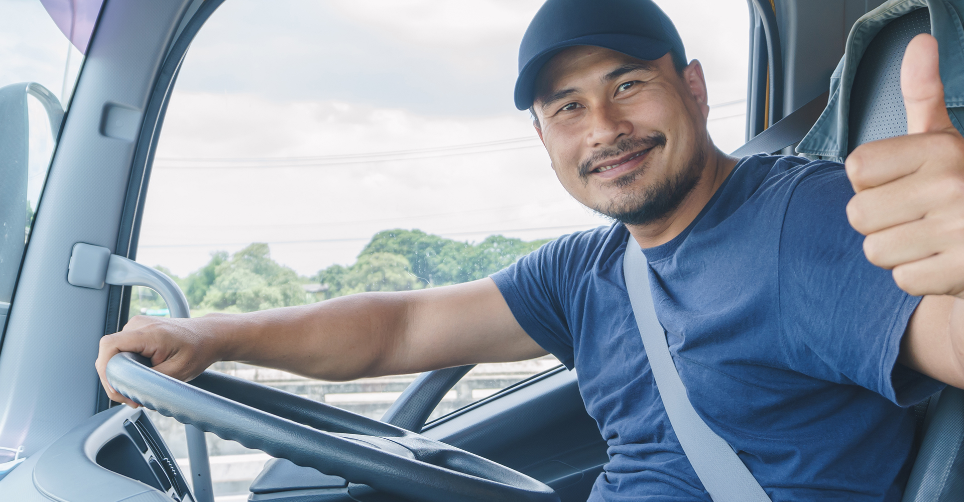 Semi-truck driver smiling