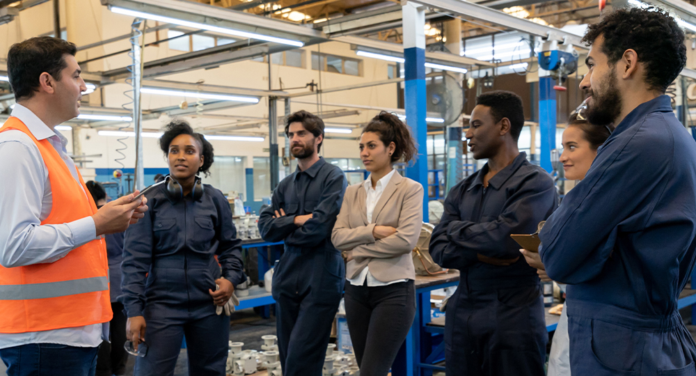 Employees listening to safety manager