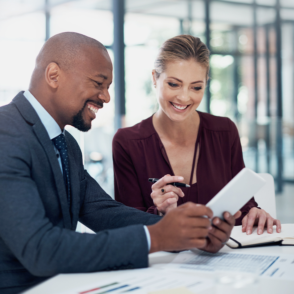 Smiling male and female business owner